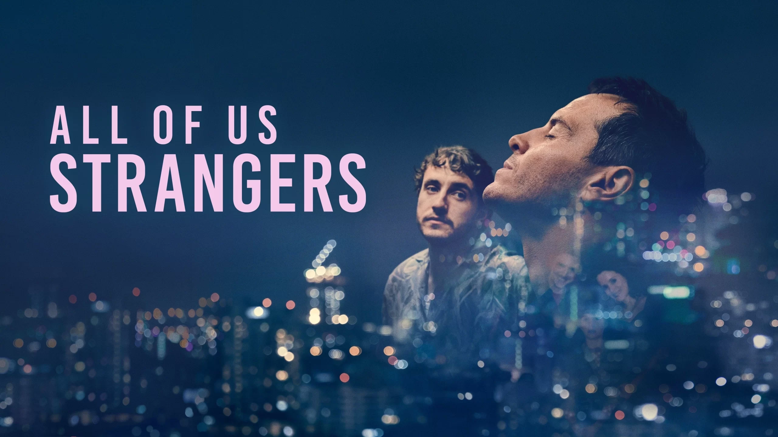 A city skyline at night with blurred lights forms the background. Two men are overlaid on the right, facing opposite directions, one with eyes closed. Large text on the left reads, All of Us Strangers.