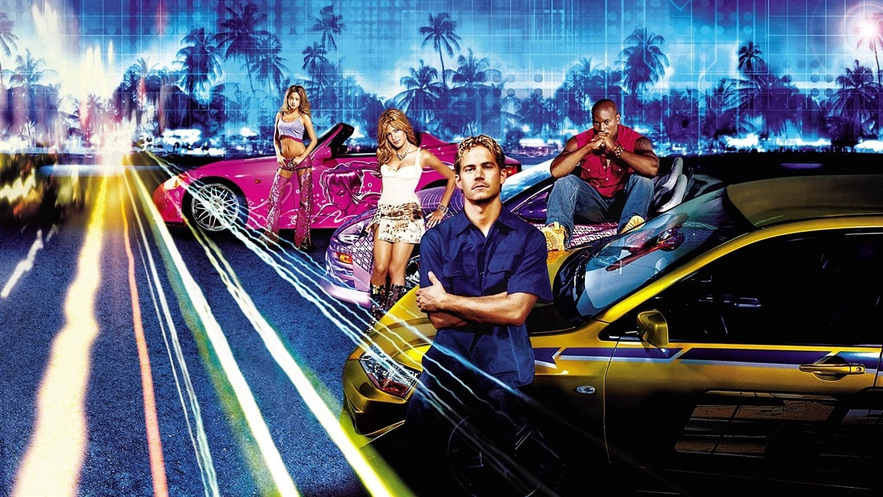 A fast and furious group stands confidently in front of brightly colored sports cars, including pink and yellow ones. Palm trees and neon lights create a vibrant 2003 urban vibe in the background.