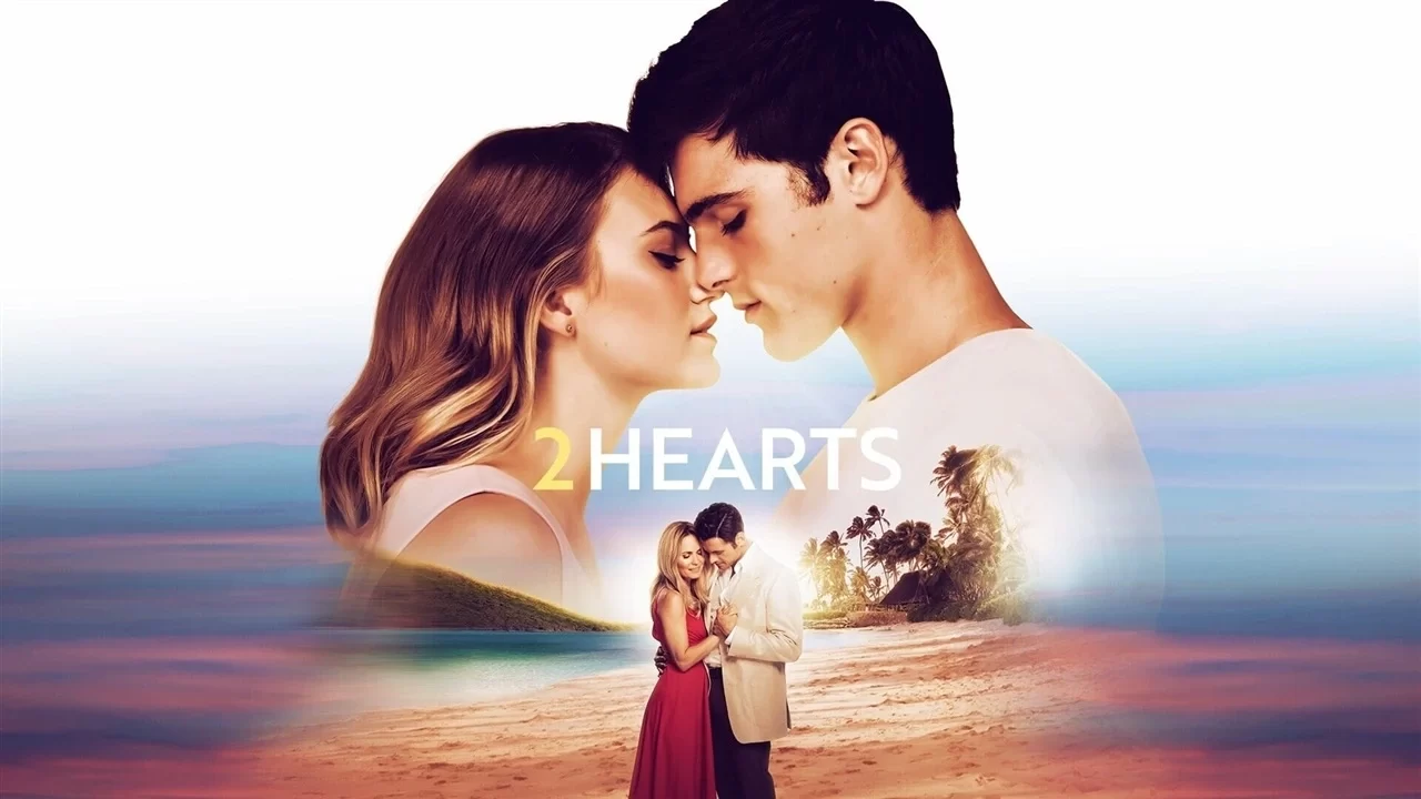 A couple stands close, eyes closed, under the word 2 Hearts. Below, a smaller image shows them embracing on a beach at sunset.