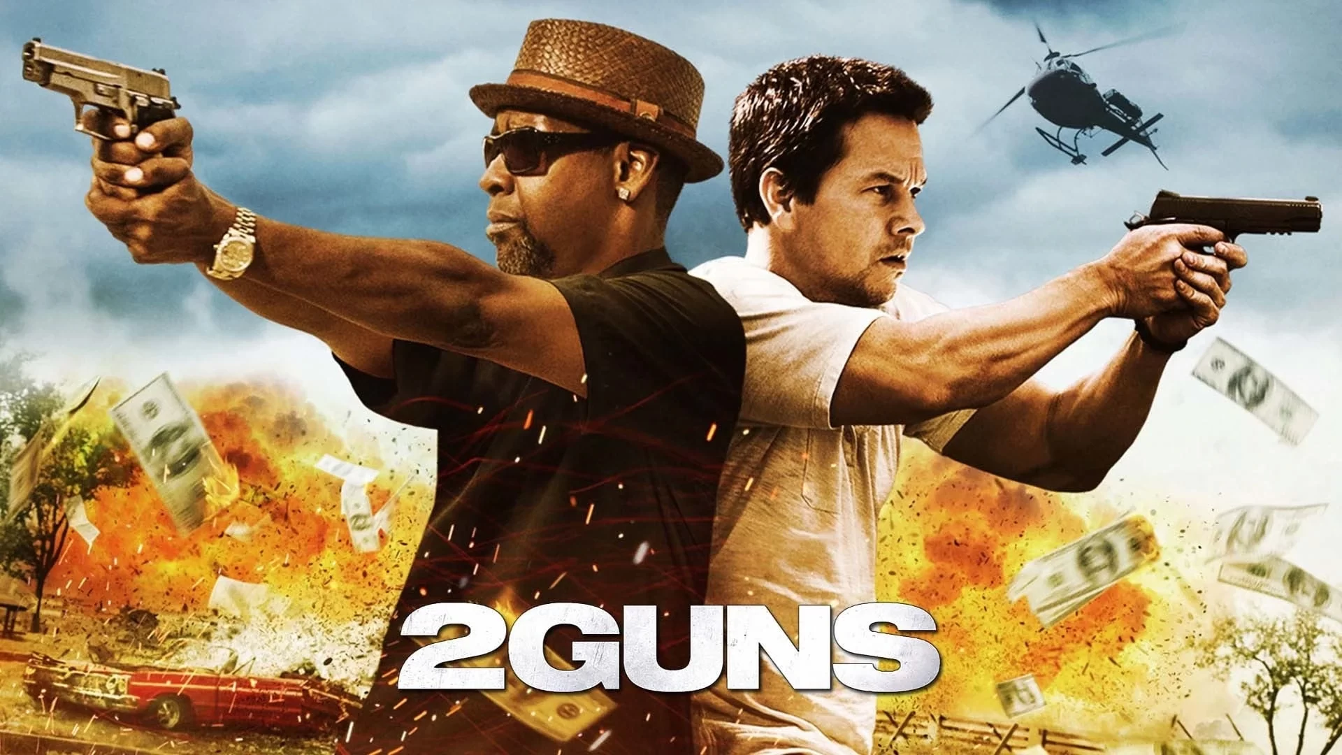 Two men holding guns and pointing in opposite directions with explosions and flying money in the background; a helicopter is visible in the sky. Text reads 2 Guns.